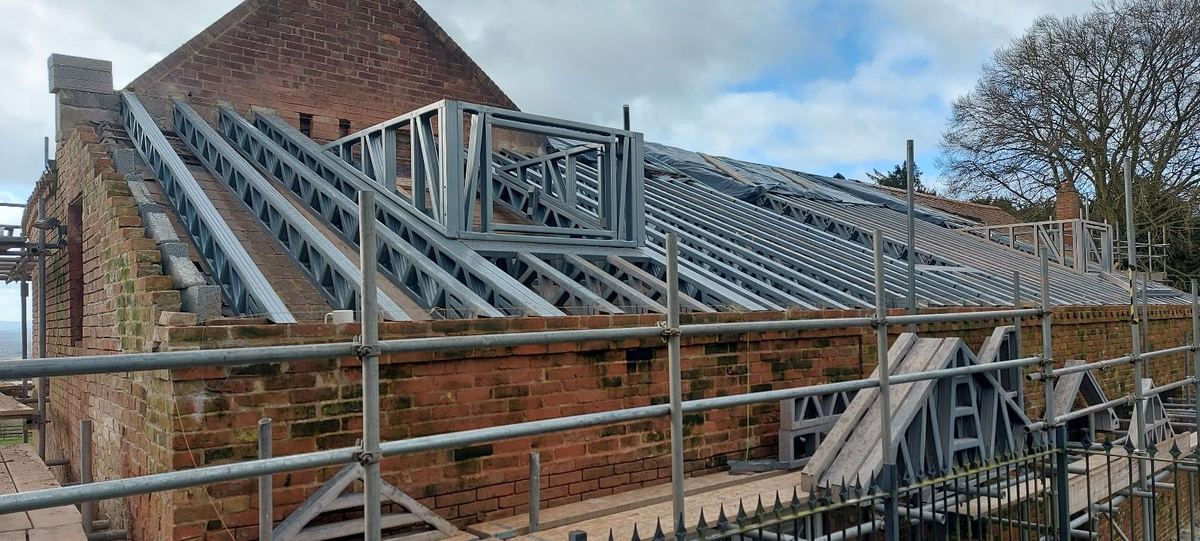 Steel rafters being installed on the fire-damaged building